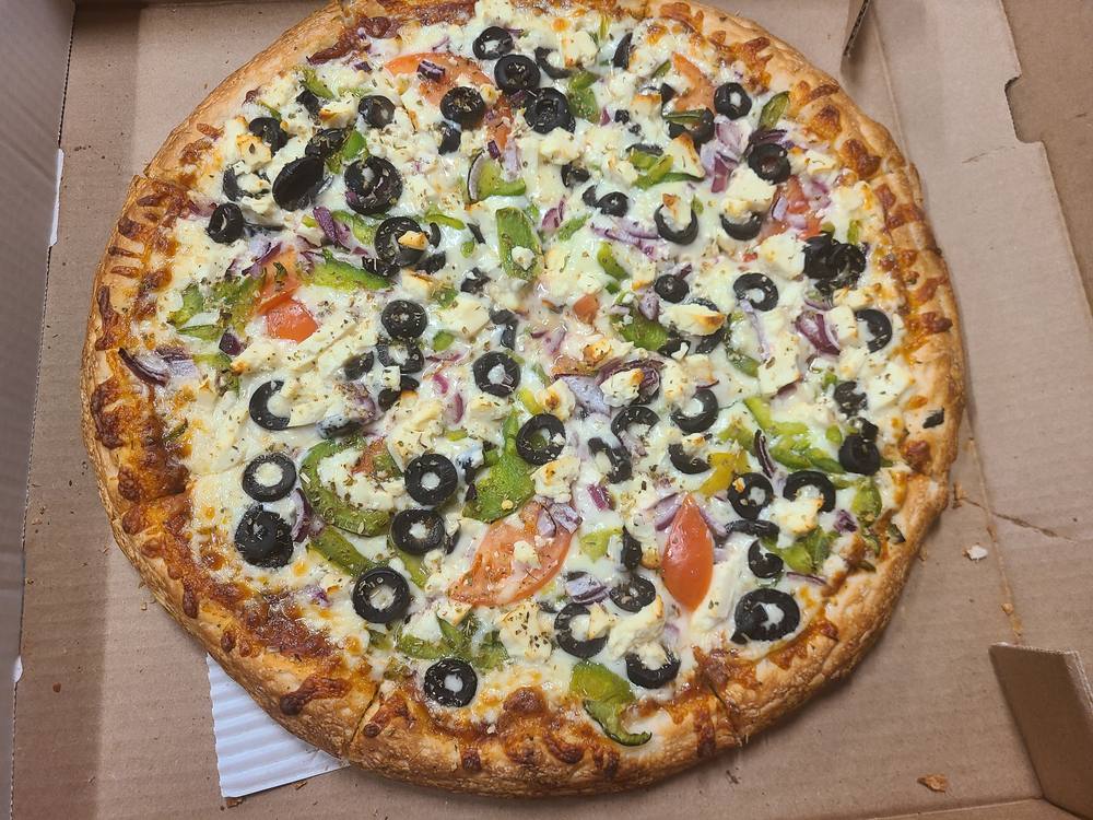 Greek pizza topped with feta, tomato, red onion, green pepper and black olives.